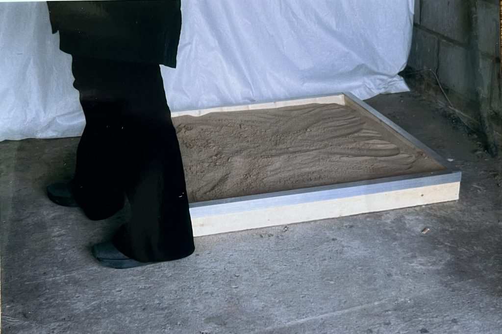 Sarah Simpkin
Beach Party Dance Floor, 1999
A sculpture made of timber, metal and sand on the floor of a temporary gallery space.
